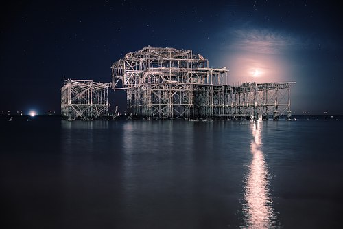 CRESCENT MOON SETTING OVER THE WEST PIER