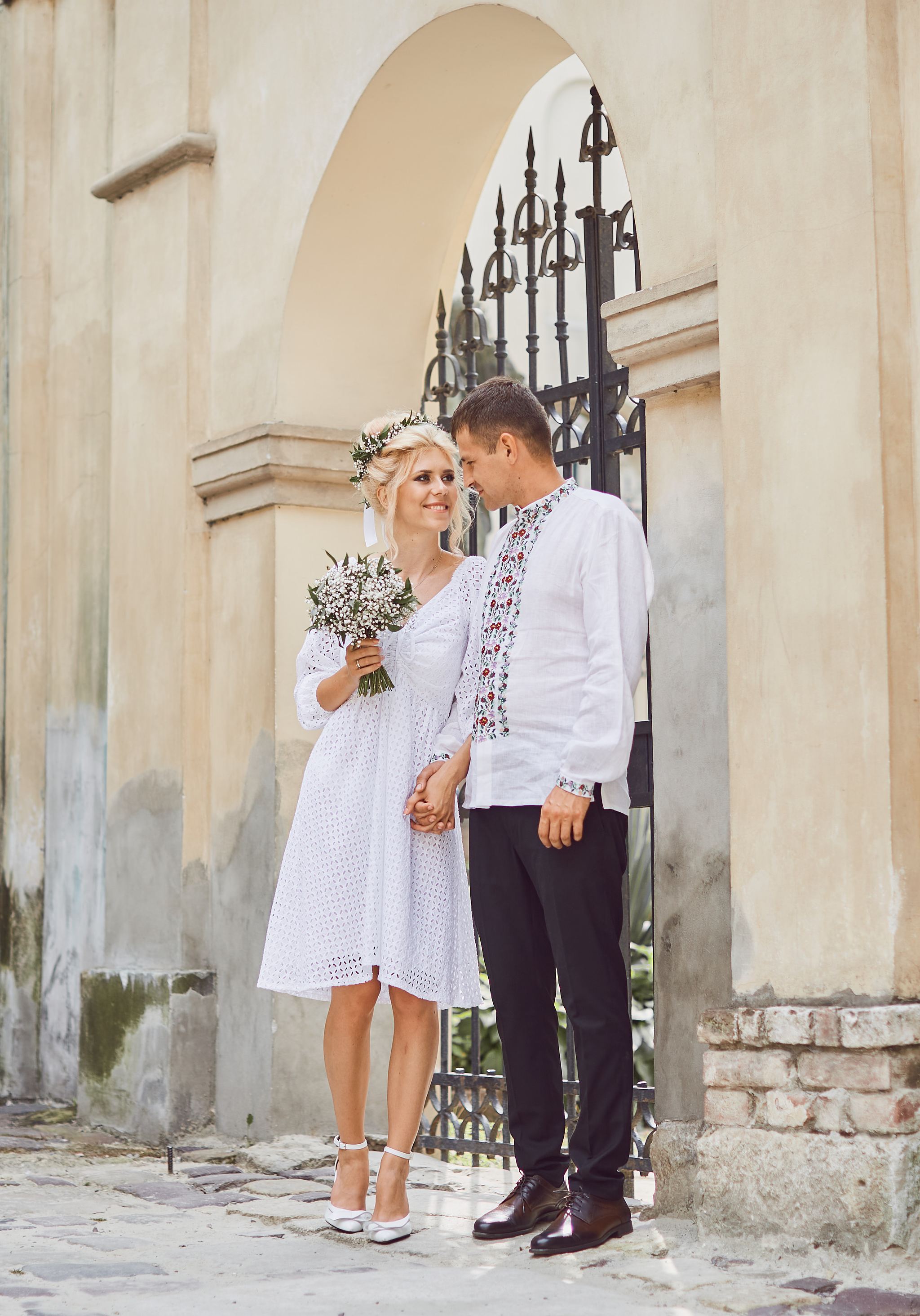 Groom kissing the bride on the cheek