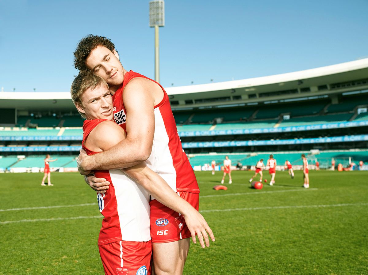 Sydney Swans played have a rather awkward embrace and hug for QBE insurance ad campaign.