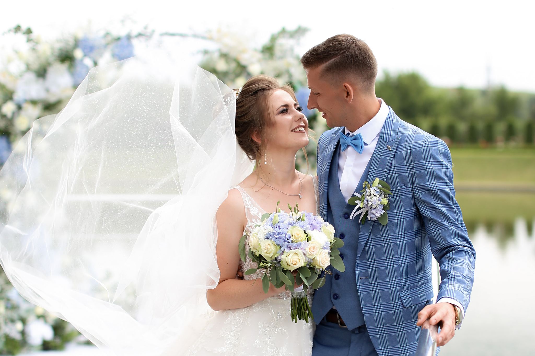 Bride and groom sharing a romantic moment on their wedding day in Ukraine