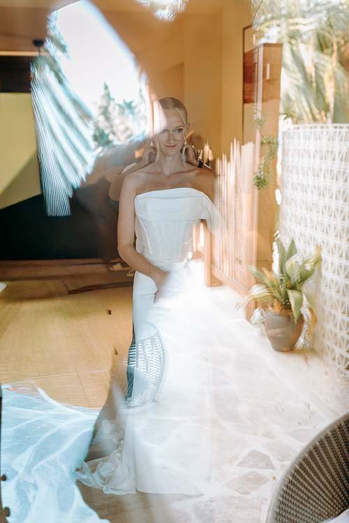 Bride walking through the venue before the ceremony