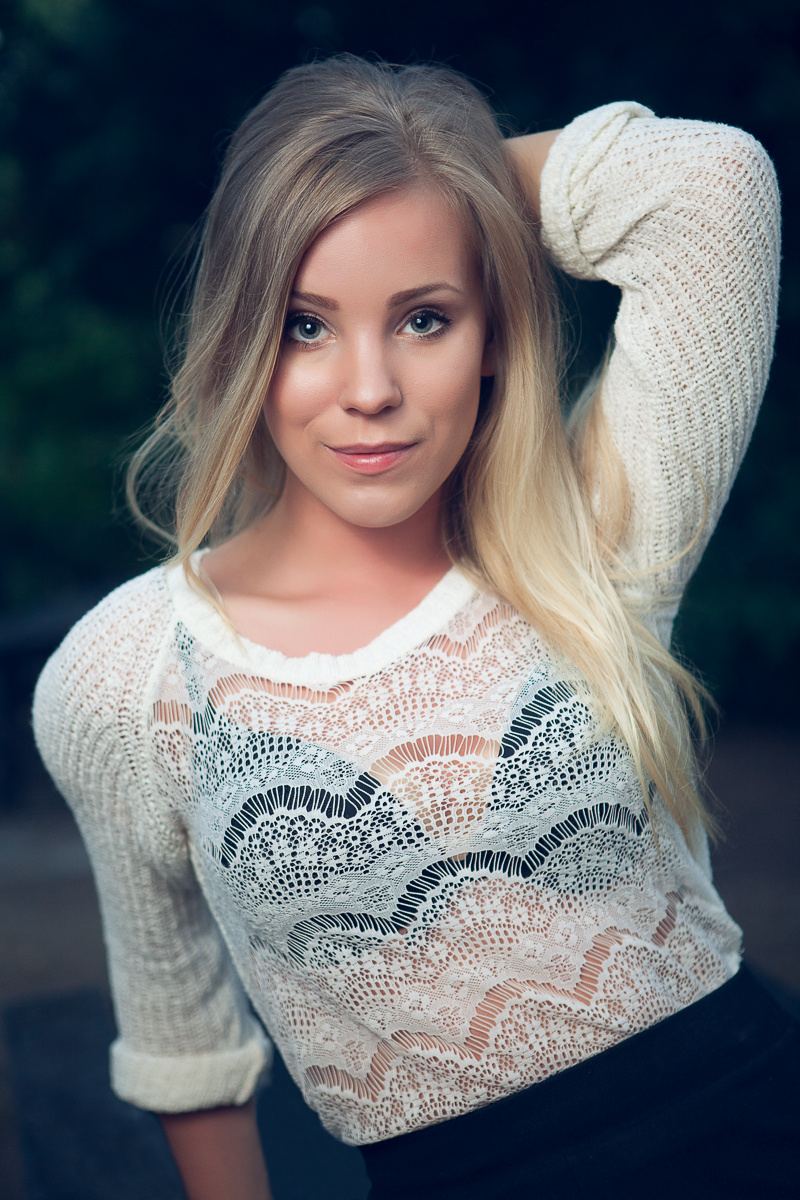 Close-up portrait of a blonde woman outdoors
