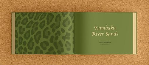 Double-page chapter opening spread of the photobook featuring a green-toned leopard print vector pattern on the left page and the title &lsquo;Kambaku River Sands&rsquo; in a beige decorative font on a plain grass green background on the right.