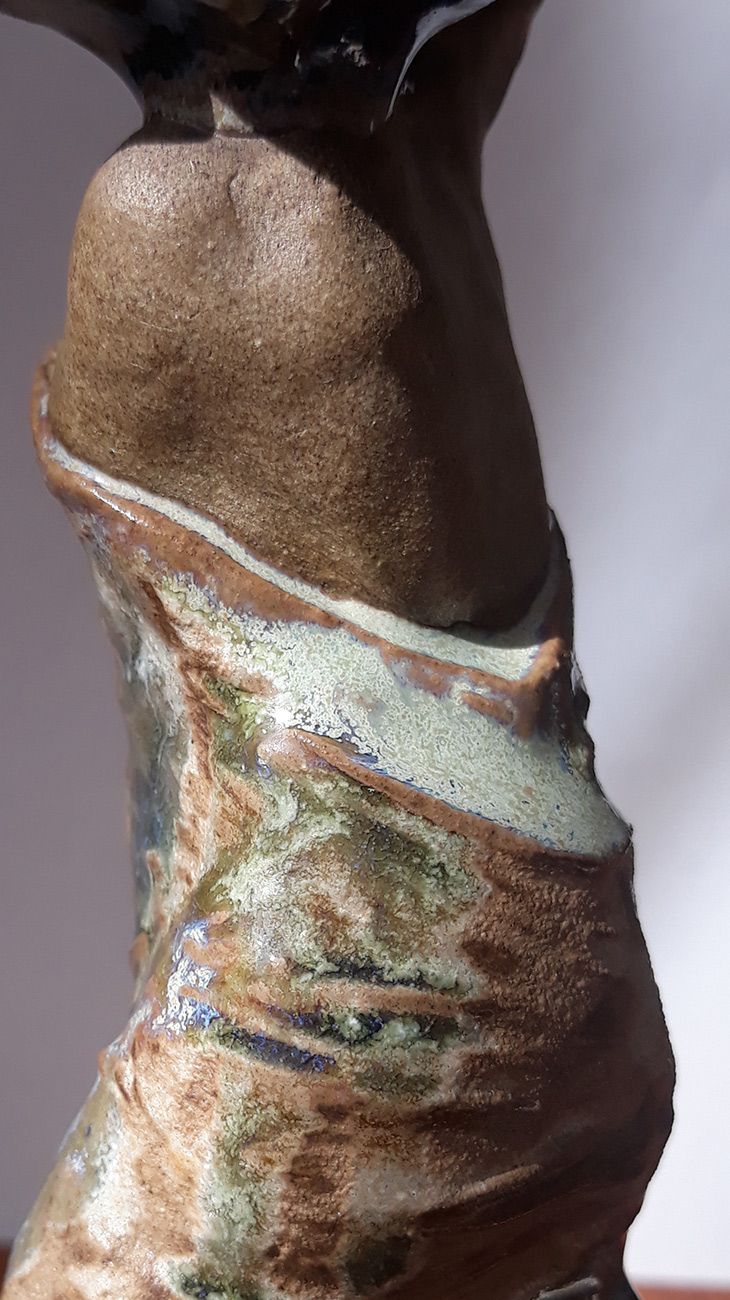 Aquarius (Verseau): Hand-built ceramic sculpture from the Moons Project, featuring a sensual back and intricately carved, enameled robe. Created by Nicolas Contr&eacute;ras.