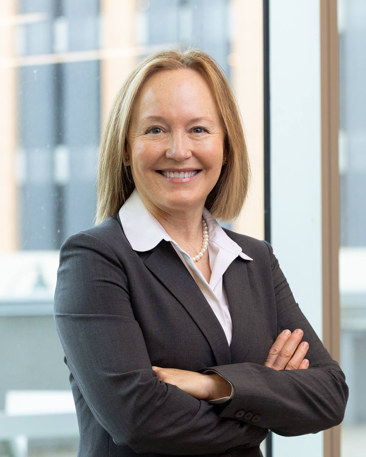 A business leader poses for a headshot at The Junction in Chapel Hill, NC