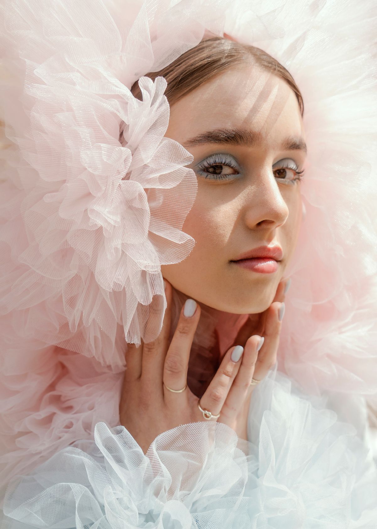 Portrait of a model wearing tulle fashion pieces. Photographed by Filianna Karamanli.