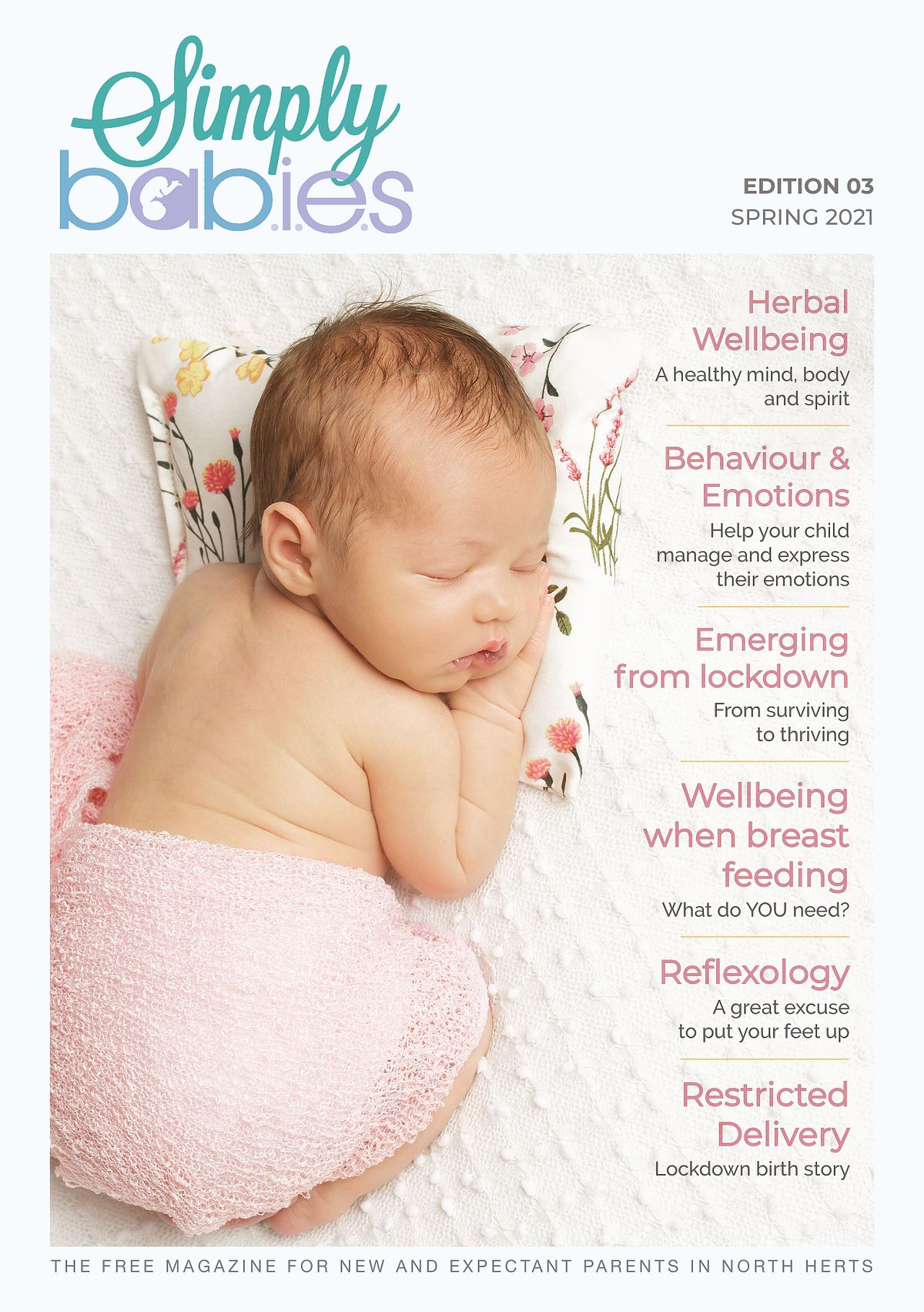 magazine cover with a sleeping baby wearing a pale pink cotton nappy