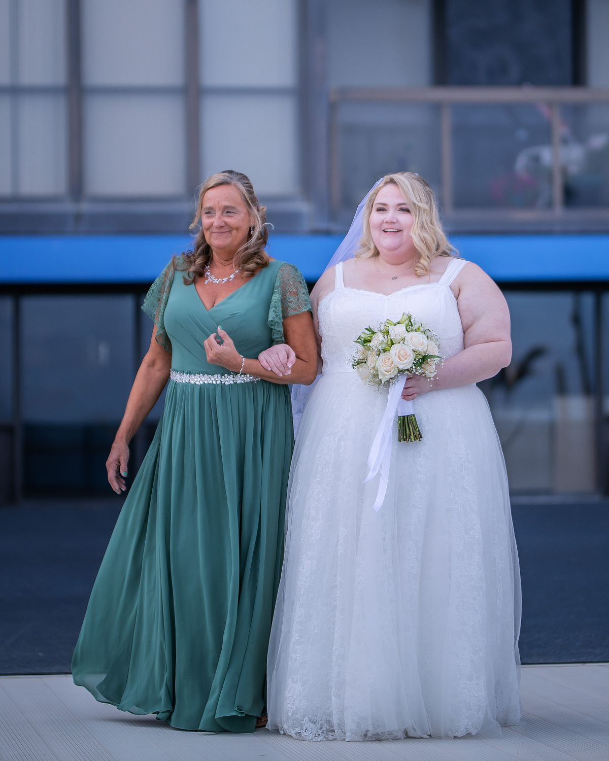 bride and her mom walking down the aisle during a unplugged wedding ceremony at golden sands on ocean city, md