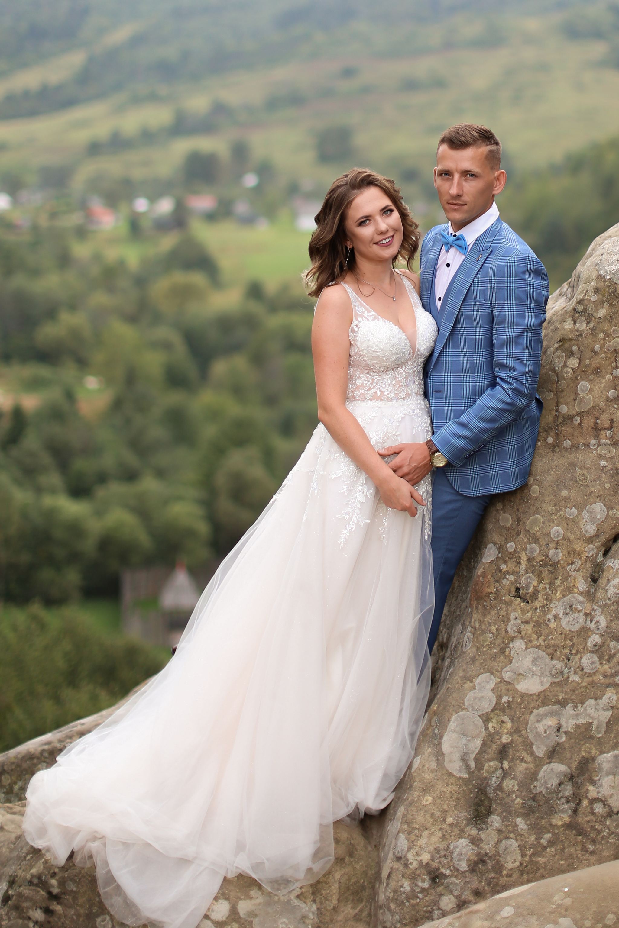 Bride and groom portrait among the rocks at Tustan Fortress, Ukraine