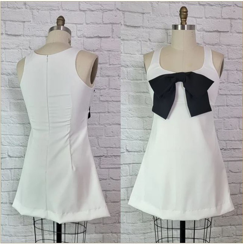 priscilla presley white dress black bow Priscilla Presley's Wedding Dress: All About the Iconic Gown