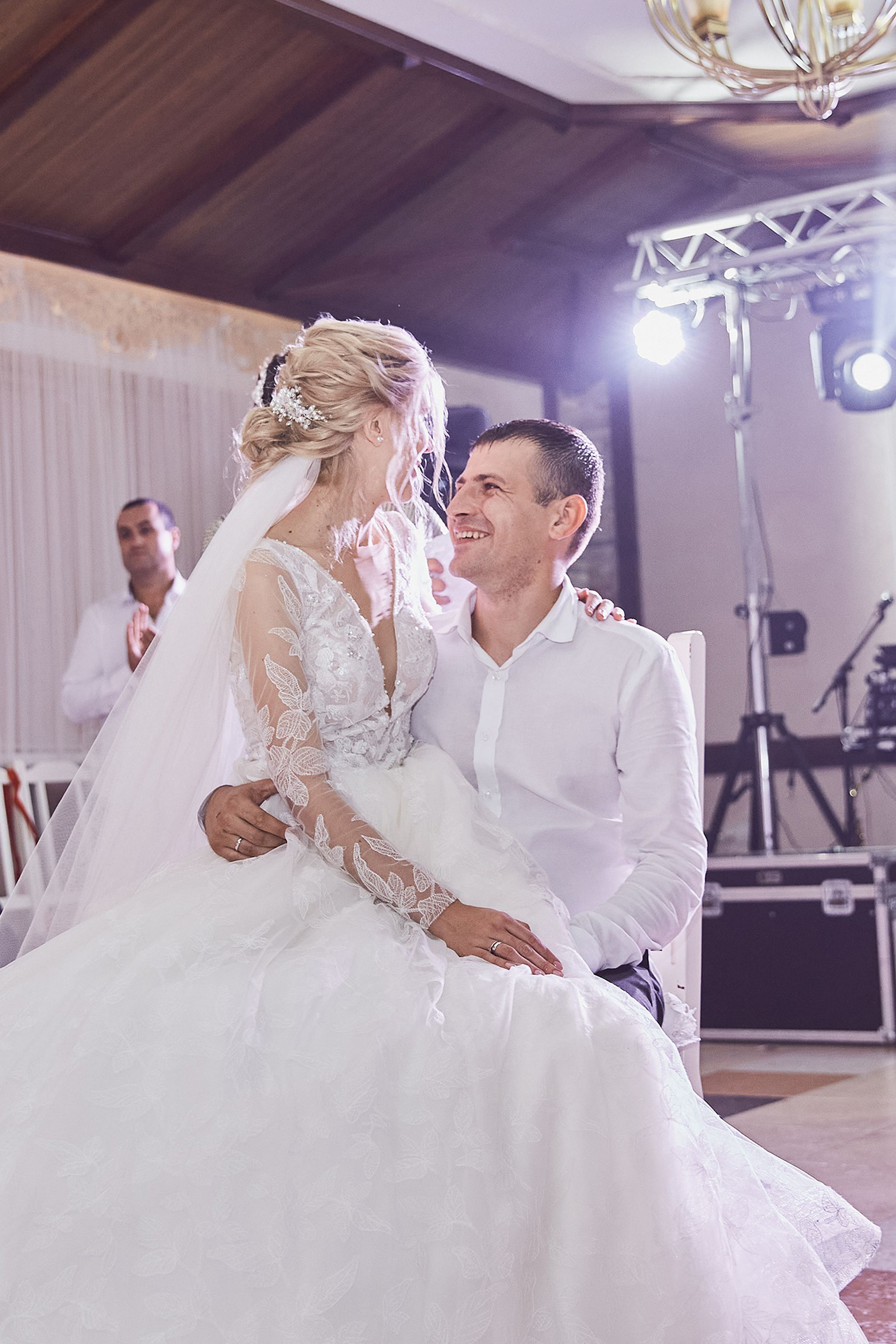 Bride and groom sharing a joyful moment during the wedding reception