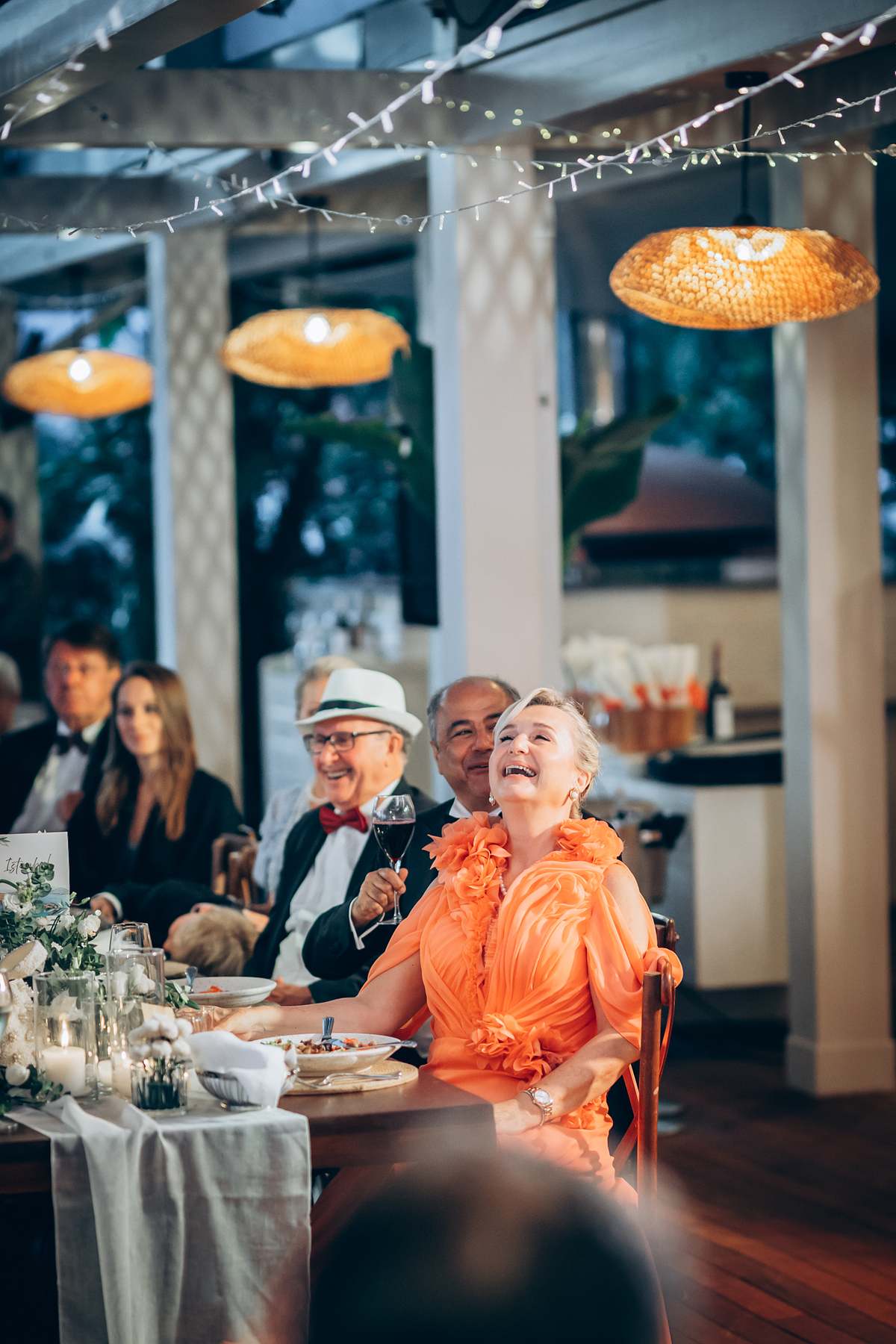 Wedding guest laughing during the reception dinner in Göcek