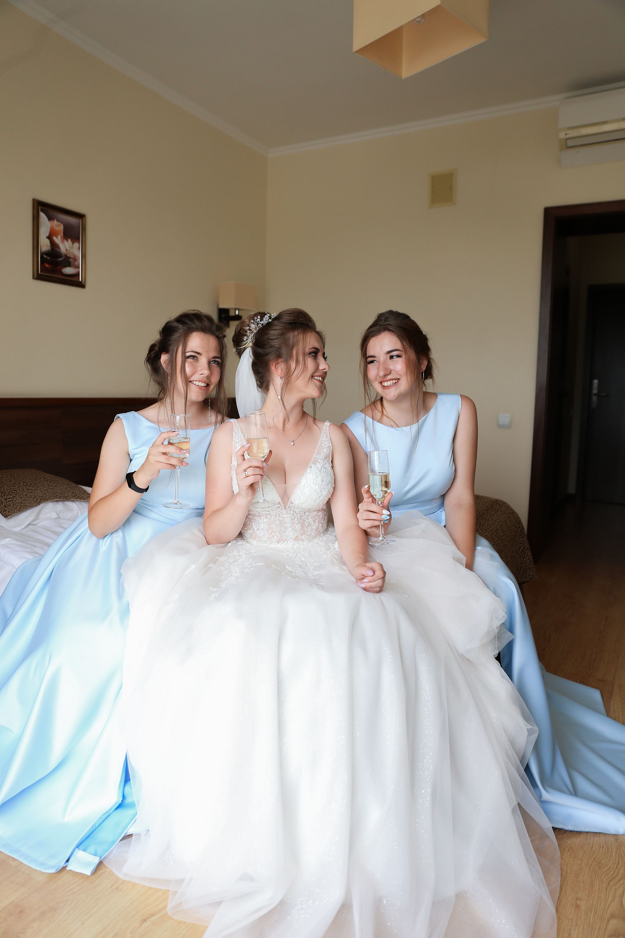 Bride with her bridesmaids getting ready on the wedding morning in Ukraine