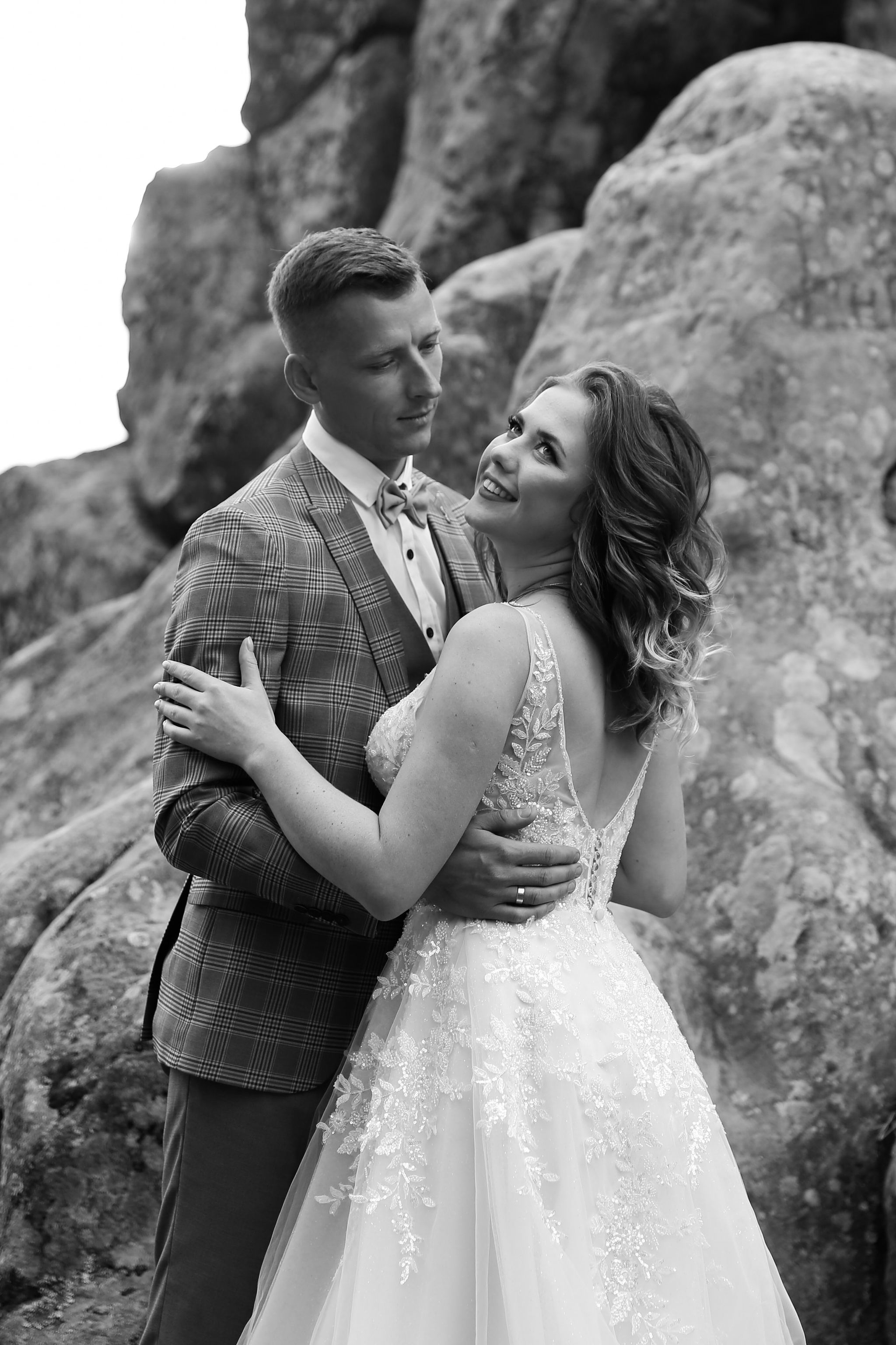 Bride and groom portrait among the rocks at Tustan Fortress, Ukraine