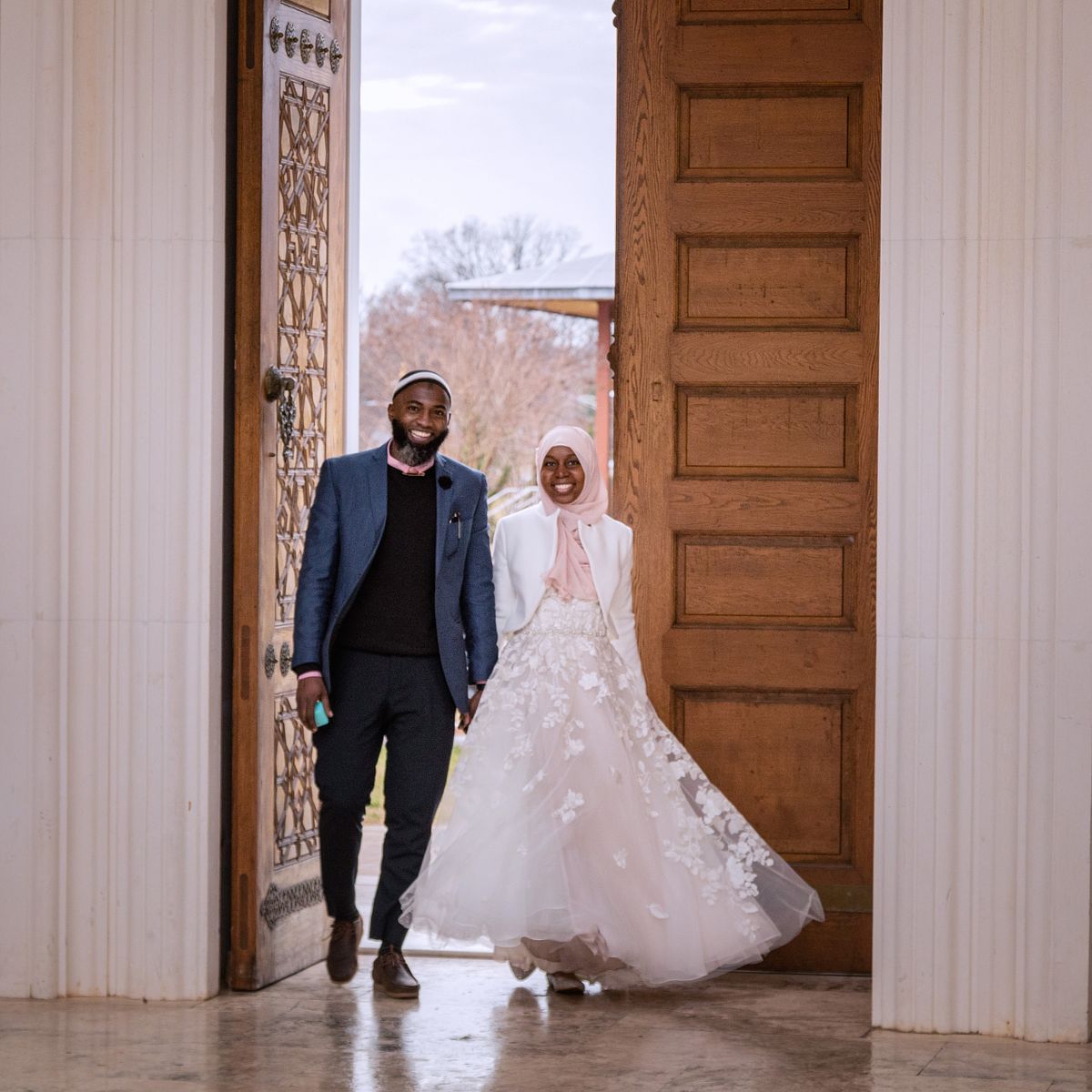 couple entering the mosque together after their traditonal wedding in washington, dc