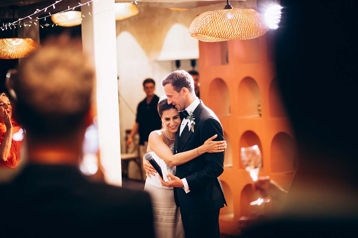 Bride and groom embracing during their wedding speeches in Göcek