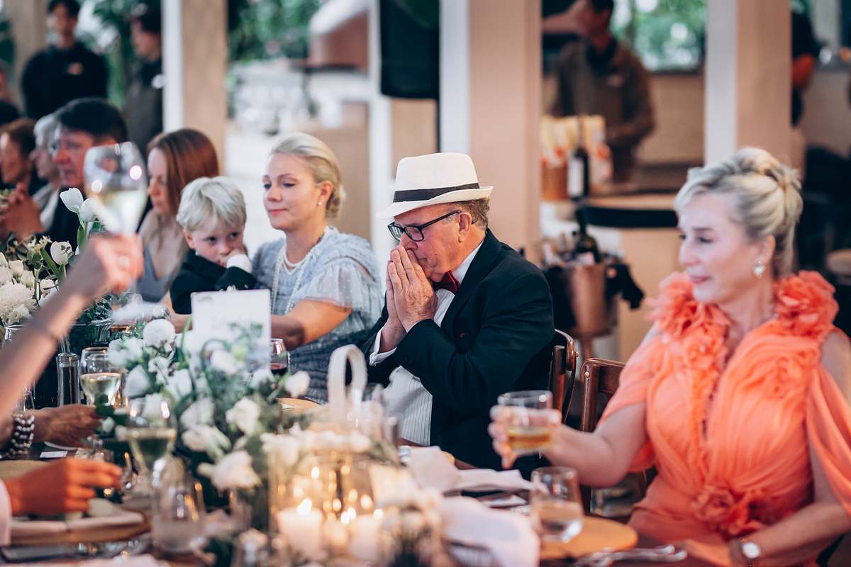 Guest reactions during speeches, documentary wedding photo