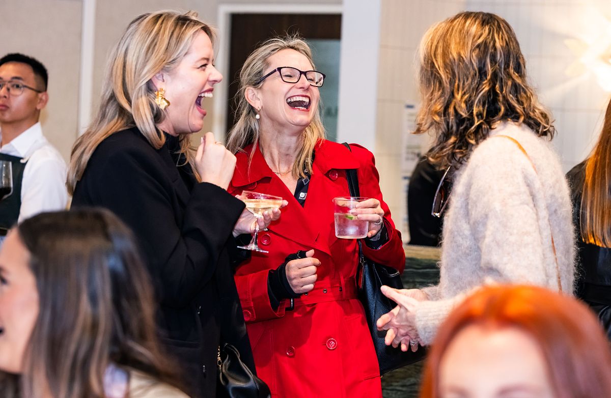 THree women engage in smiles and laughter at the Yaffa Media &ndash; Ragtrader, Australian Fashion Industry Awards.