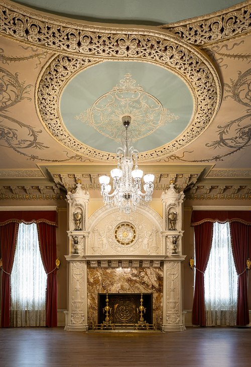 Thomas Edison clock set within the carved onyx fireplace mantel in the Flagler Room of Ponce de Leon Hall.