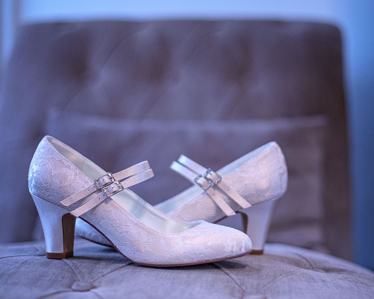 close up shot of laced shoes on chair