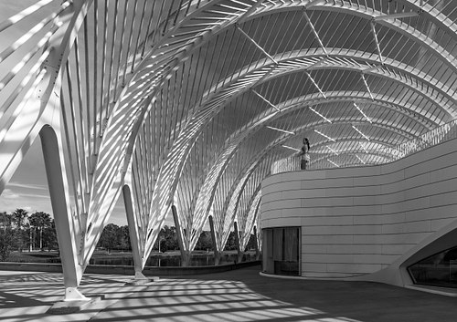 Black and white fine art photograph showcasing the curved geometric lines and modern architecture of Santiago Calatrava's IST building in Lakeland, Florida.