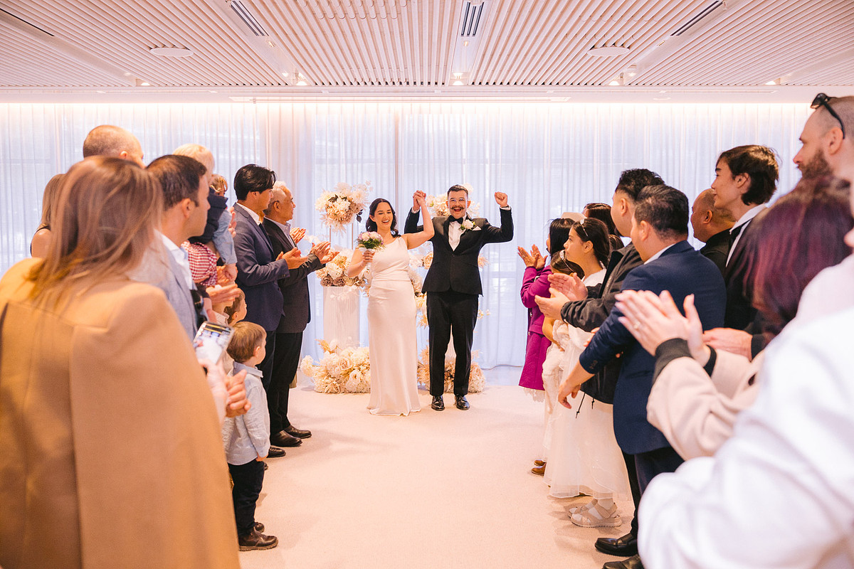 Guests cheering for the newlyweds at the wedding ceremony at Pyrmont Wedding Registry.