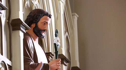 Side angle of the restored statue of Saint Joseph in good, raking light.