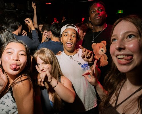 a group photo in a nightclub in the Portside Pub in Vancouver