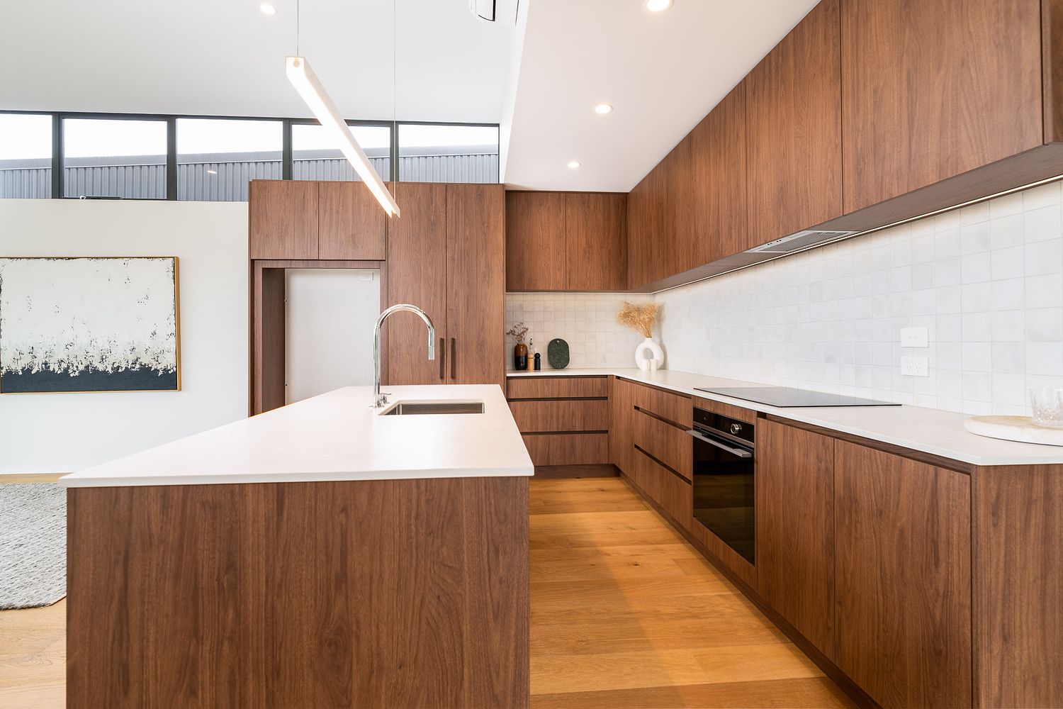 Modern kitchen interior at West Village, Rangitahi Peninsula, Raglan, photographed by Flax Cove Studio.