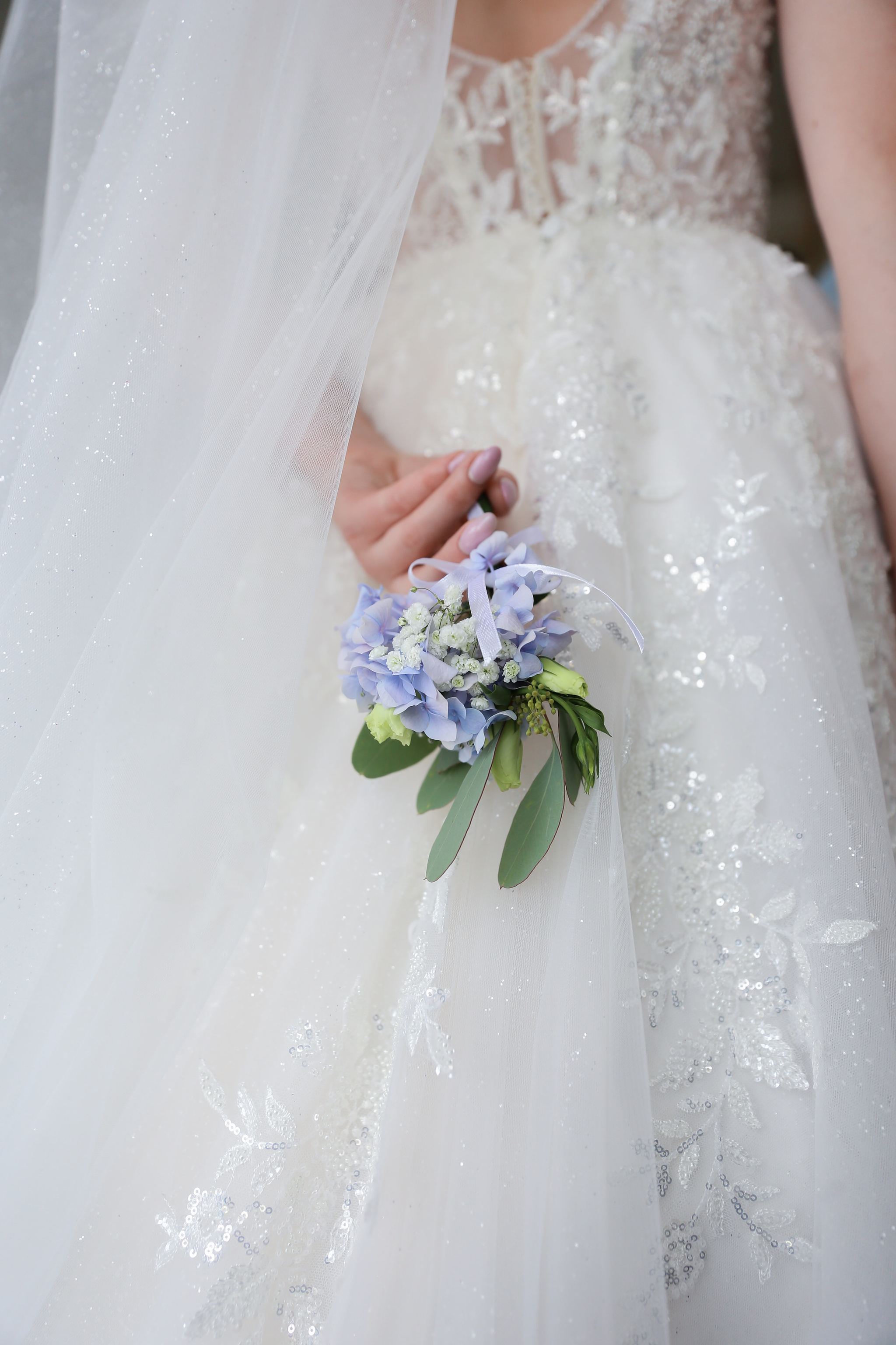 Bride holding her wedding bouquet before the ceremony in Ukraine