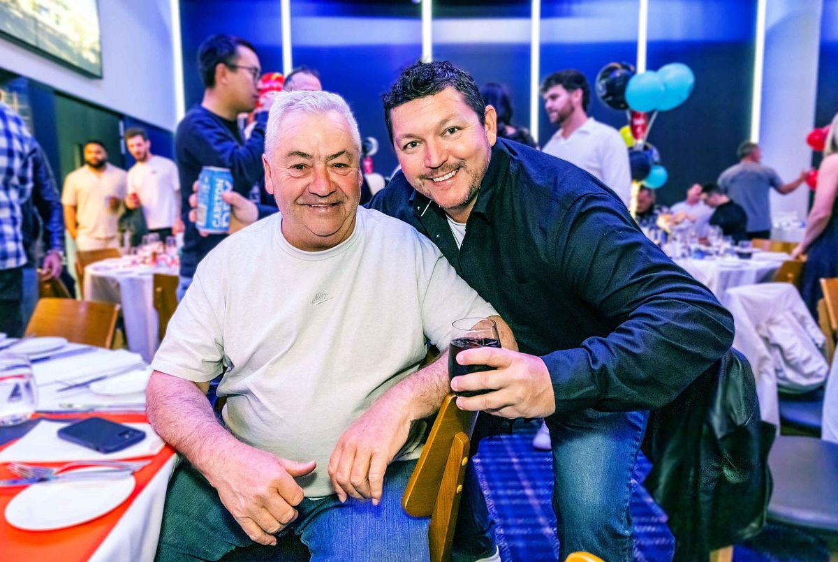 Two work colleagues pose for a photo at the Keller end of year, corporate function and event.