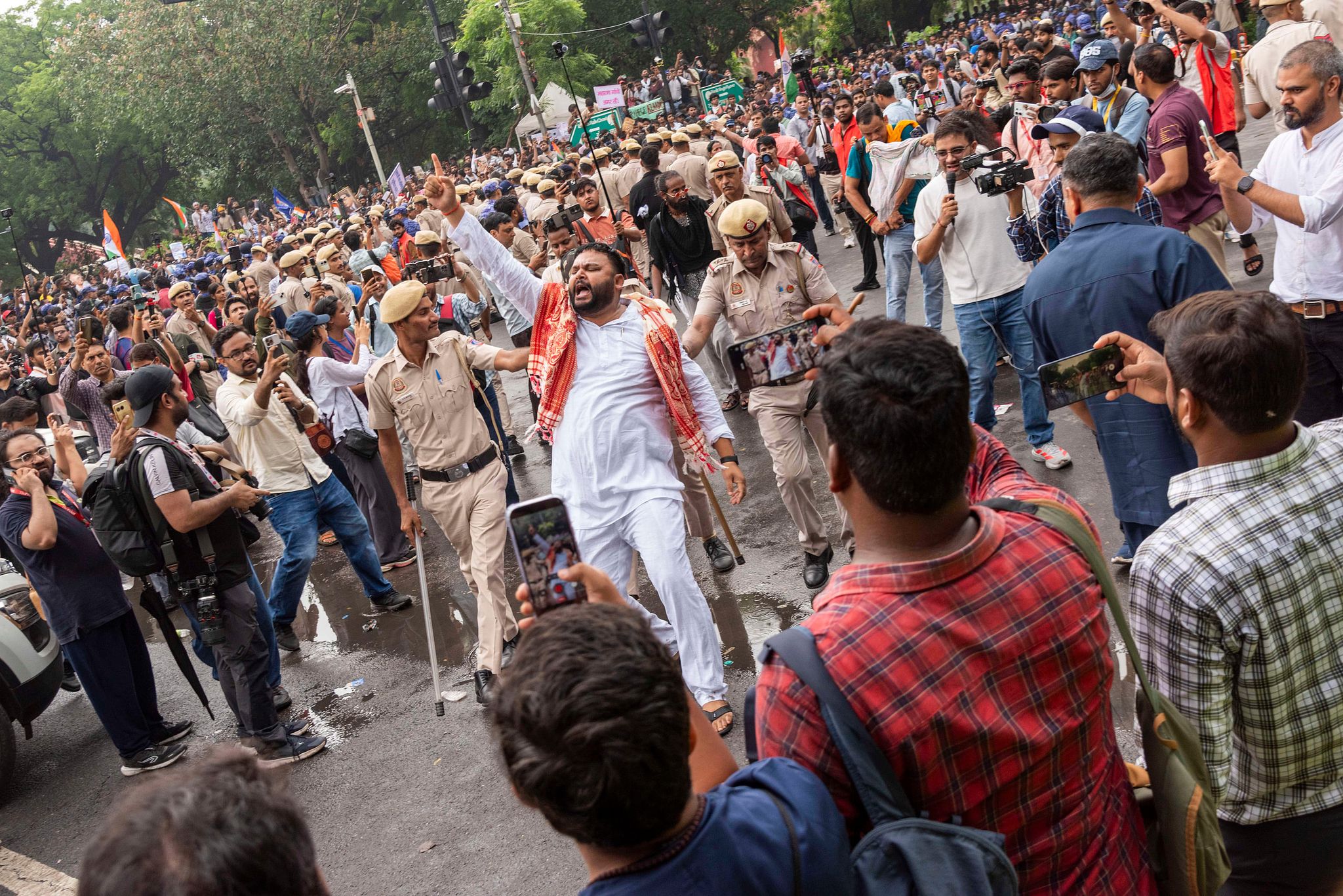 Supporters of India's Cockroach Janta Party (CJP) gather before a march to Parliament in New Delhi