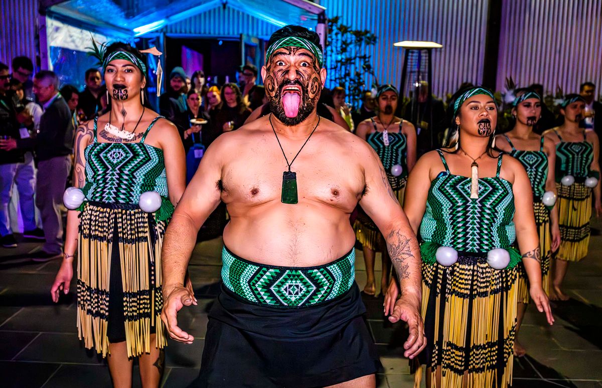 Portrait of several Maori's performing the Huaka.