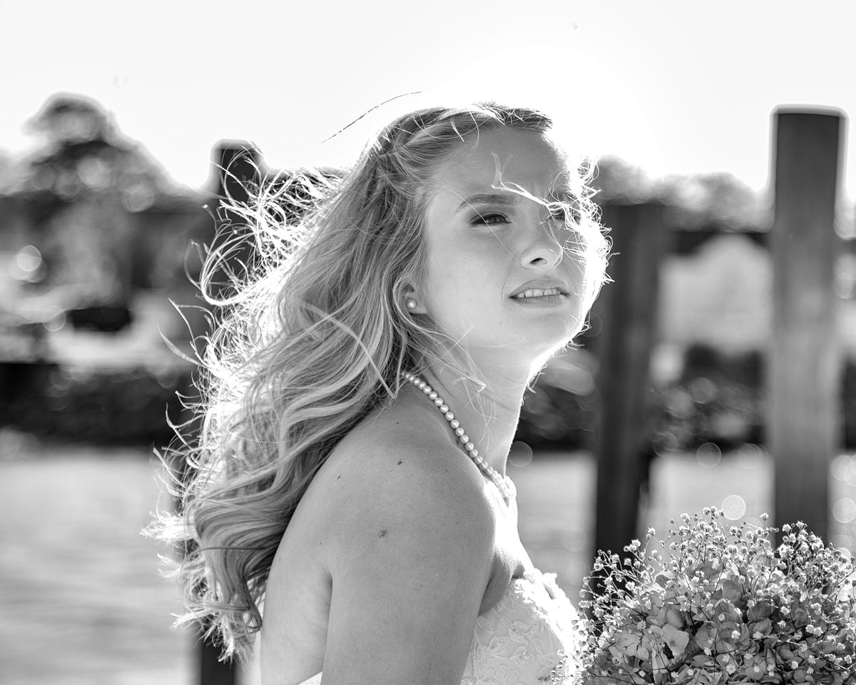 candid moment of the bride with the wind blowing her long blond hair, Lewes, dE, Irish penny