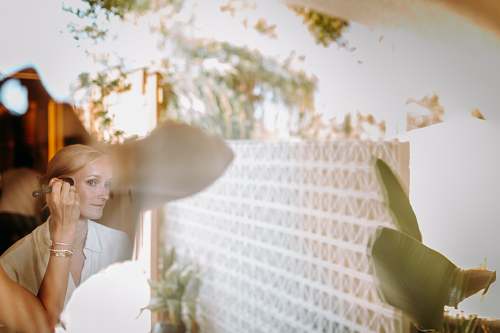 Bridesmaids helping the bride get ready at Avantgarde Refined