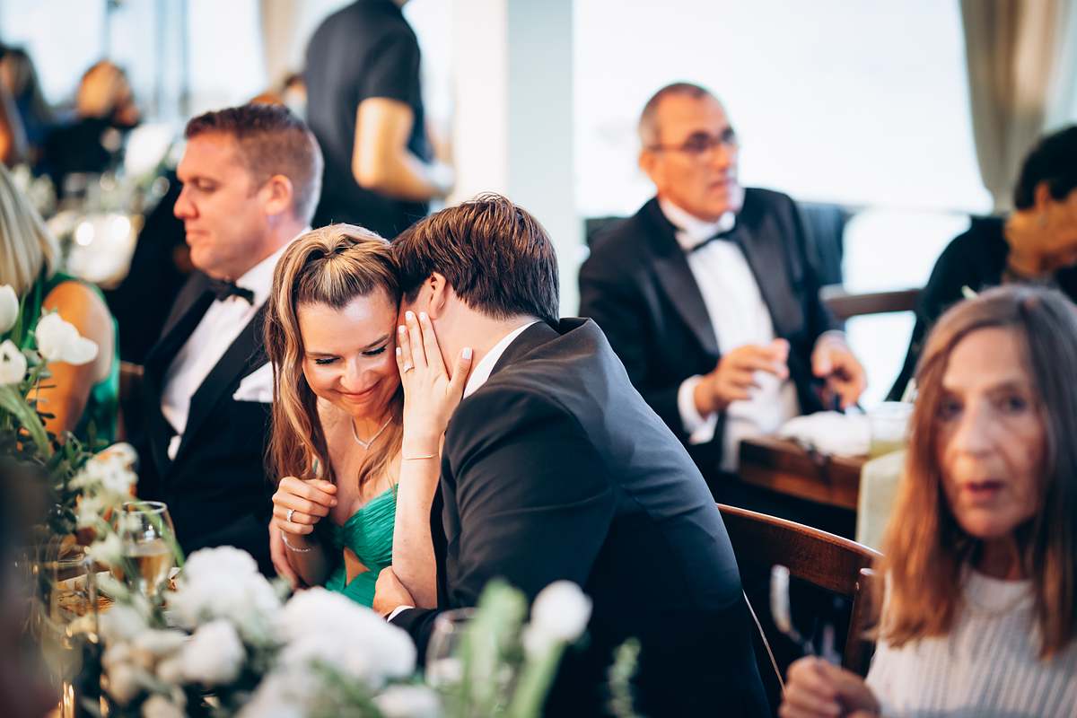 Wedding guests sharing a candid moment during dinner at D-Resort Göcek