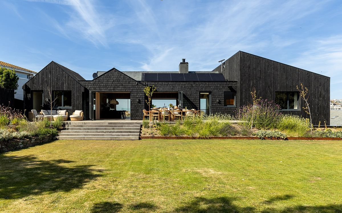Rear elevation of a  black-clad holiday home in Cornwall