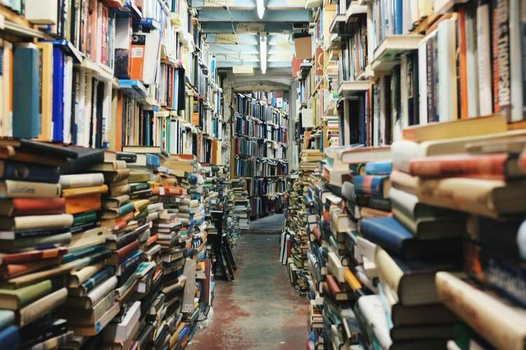 stacks of books and research materials