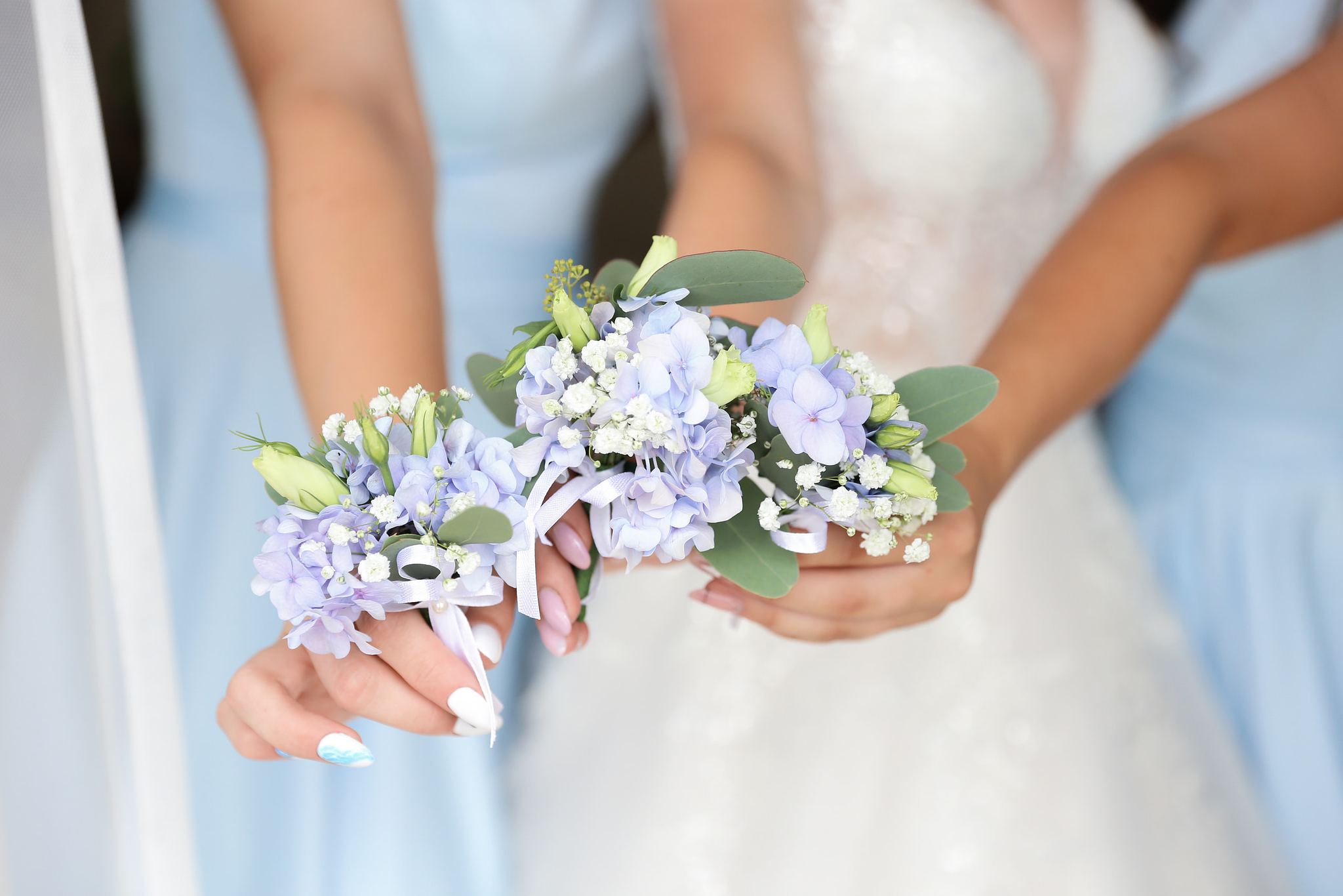 Blue and white wedding flowers during bridal preparations in Ukraine