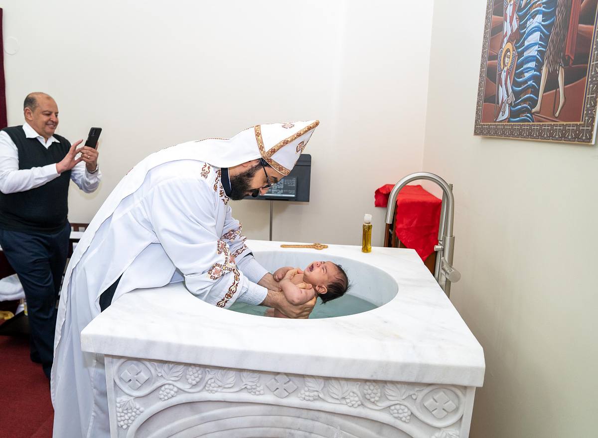 Ottawa Orthodox baptism photographer capturing emotional moments