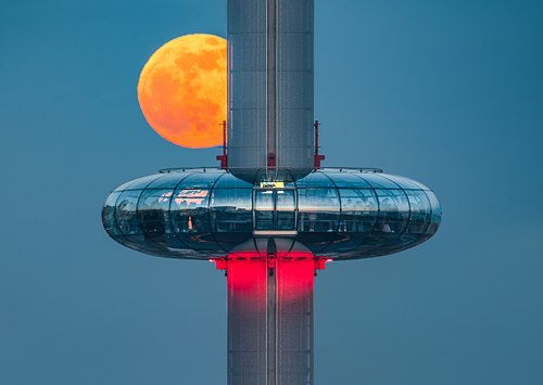 PINK MOON REFLECTING IN THE BRIGHTON I360 POD