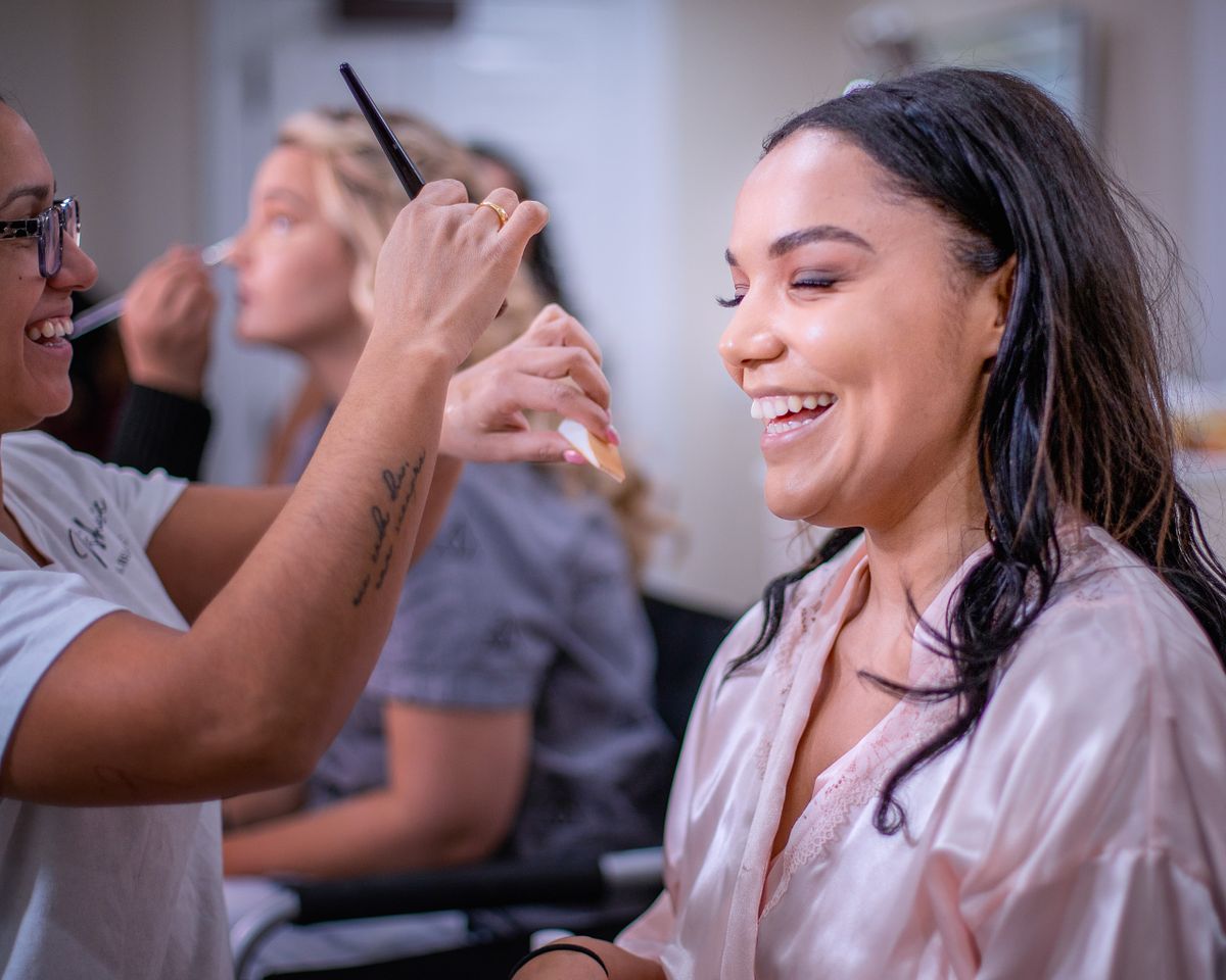 candid moment of bride with her make-up artist laughing at baywood in Millsboro, de