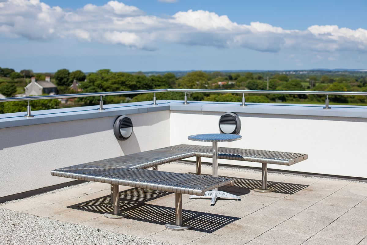 Rooftop terrace at Tremough Innovation Centre Cornwall with seating and countryside views.