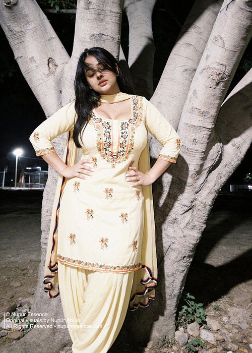 Traditional Punjabi fashion portrait captured during a nighttime outdoor session.