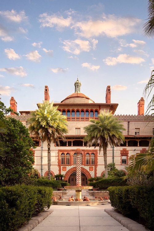 Sunrise view of the courtyard fountain and Ponce de Leon Hall facade at Flagler College, St. Augustine.