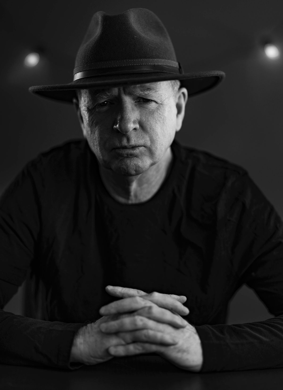 Portrait of a designer on a dark background in my home studio in St Kilda.