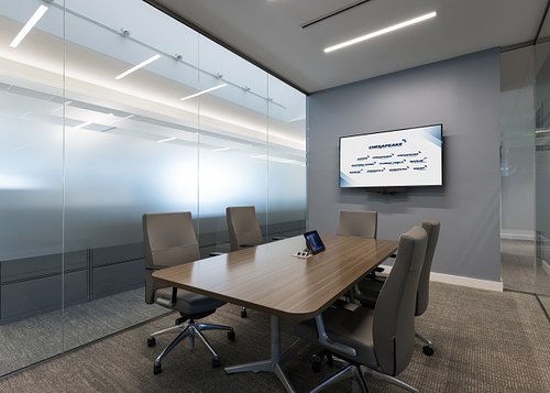 Modern glass walled FPU conference room in Yulee, Florida by Polk Stanley Wilcox Architects.