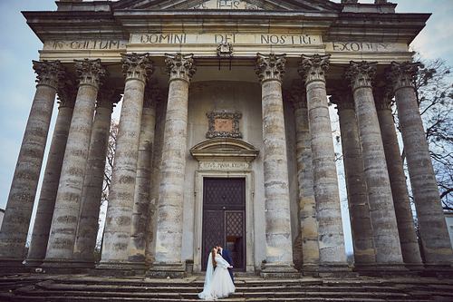 Romantic bride and groom portrait near Pidhirtsi Castle