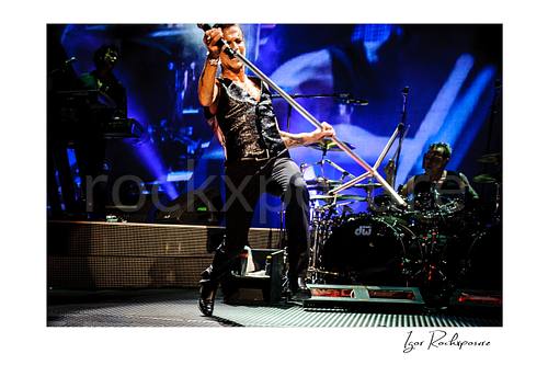 Horizontal color image of Depeche Mode members Dave Gahan and Christian Eigner performing on stage