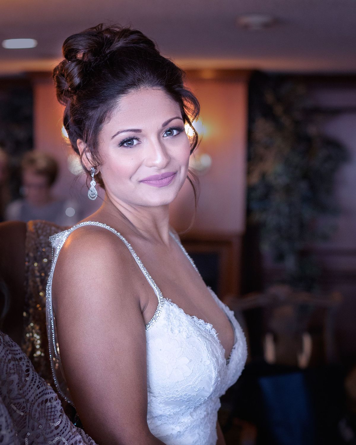 close up of the bride in the bridal suite getting ready before the ceremony on the beach